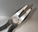 Pair of pliers with 'Utica' branding on a neutral background