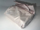 Folded light gray fabric on a white background