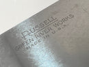 Metal blade with 'Russell Green River Works Made in U.S.A.' engraving on a light background