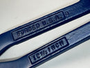 Two blue metal wrenches with 'Forged U.S.A.' and size '12 3/4 inch' engraving on a white background.