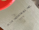 Metal surface with 'AIZAR INDUSTRIES INC.' engraving