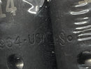 Close-up of a textured surface with embossed text and numbers.